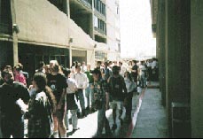 Lining up out the door, and around the building.